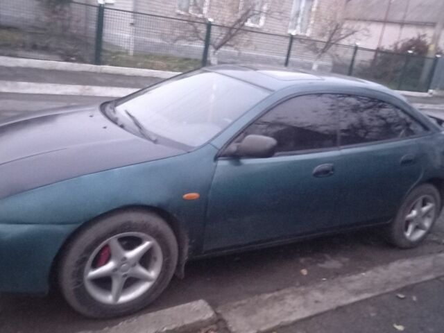 Зеленый Мазда 323, объемом двигателя 1.5 л и пробегом 185 тыс. км за 1700 $, фото 1 на Automoto.ua