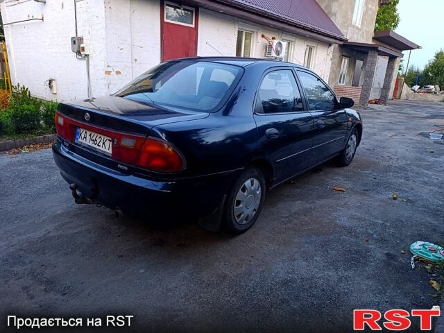 Зеленый Мазда 323, объемом двигателя 1.5 л и пробегом 235 тыс. км за 1600 $, фото 2 на Automoto.ua