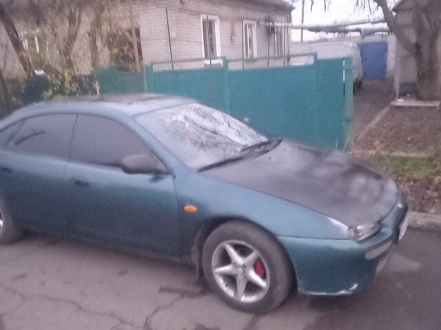 Зеленый Мазда 323, объемом двигателя 1.5 л и пробегом 185 тыс. км за 1700 $, фото 2 на Automoto.ua