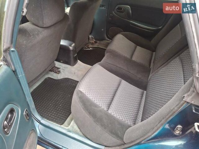Зеленый Мазда 323, объемом двигателя 1.8 л и пробегом 460 тыс. км за 2900 $, фото 4 на Automoto.ua