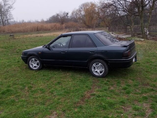 Зелений Мазда 323, об'ємом двигуна 1.6 л та пробігом 333 тис. км за 950 $, фото 1 на Automoto.ua