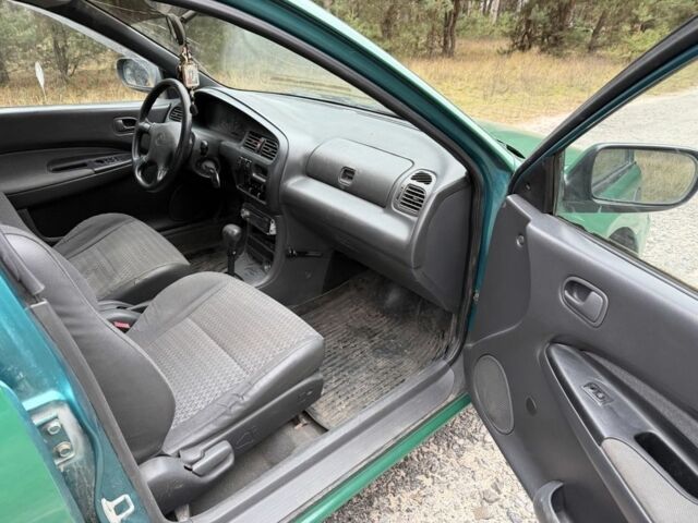 Зеленый Мазда 323, объемом двигателя 1.5 л и пробегом 213 тыс. км за 2950 $, фото 9 на Automoto.ua
