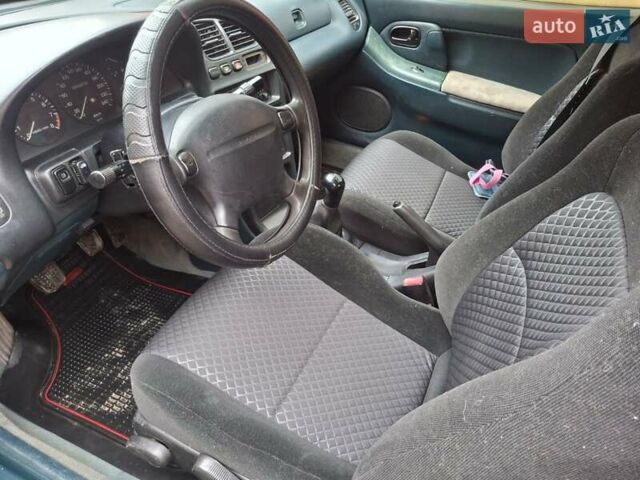 Зеленый Мазда 323, объемом двигателя 1.8 л и пробегом 460 тыс. км за 2900 $, фото 6 на Automoto.ua