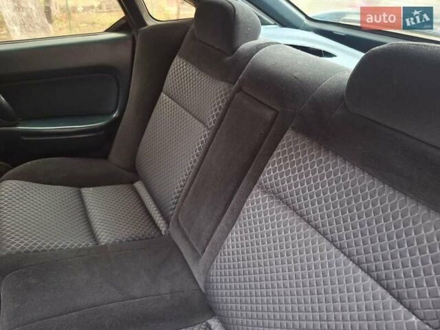 Зеленый Мазда 323, объемом двигателя 1.8 л и пробегом 460 тыс. км за 2900 $, фото 1 на Automoto.ua