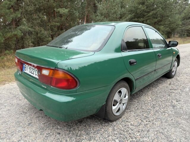 Зеленый Мазда 323, объемом двигателя 1.5 л и пробегом 213 тыс. км за 2950 $, фото 2 на Automoto.ua