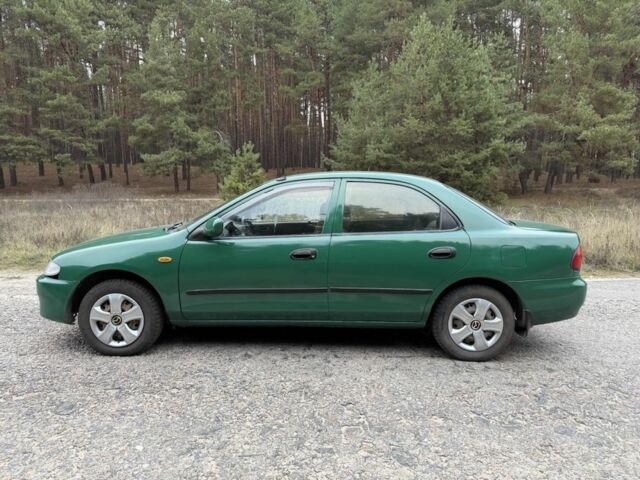 Зеленый Мазда 323, объемом двигателя 1.5 л и пробегом 213 тыс. км за 2950 $, фото 5 на Automoto.ua