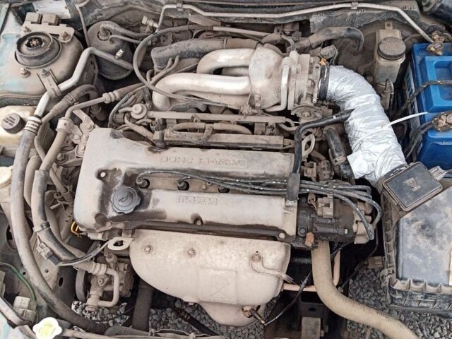 Зелений Мазда 323, об'ємом двигуна 1.5 л та пробігом 100 тис. км за 525 $, фото 4 на Automoto.ua