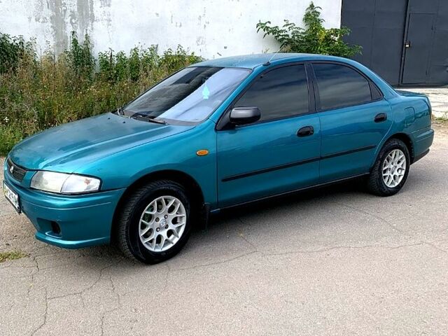 Зеленый Мазда 323, объемом двигателя 1.5 л и пробегом 254 тыс. км за 1800 $, фото 8 на Automoto.ua