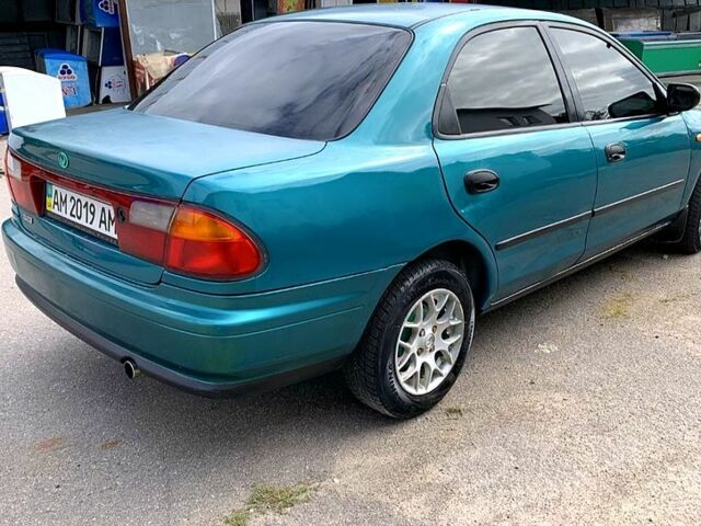 Зеленый Мазда 323, объемом двигателя 1.5 л и пробегом 254 тыс. км за 1800 $, фото 7 на Automoto.ua