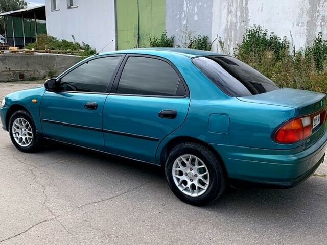 Зеленый Мазда 323, объемом двигателя 1.5 л и пробегом 254 тыс. км за 1800 $, фото 10 на Automoto.ua