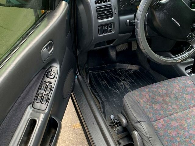 Зеленый Мазда 323, объемом двигателя 1.5 л и пробегом 254 тыс. км за 1800 $, фото 3 на Automoto.ua