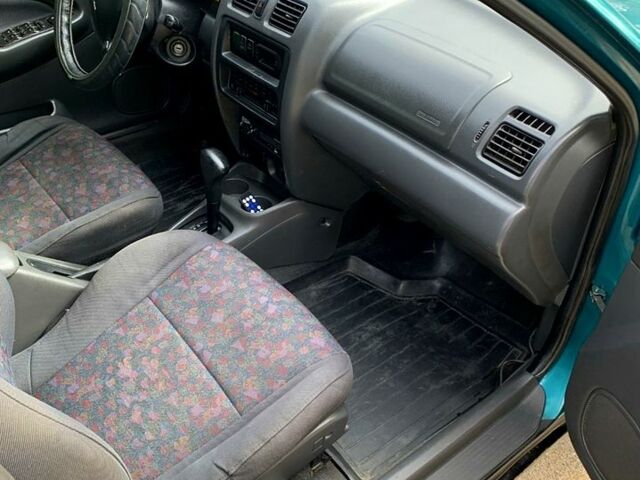 Зеленый Мазда 323, объемом двигателя 1.5 л и пробегом 254 тыс. км за 1800 $, фото 5 на Automoto.ua