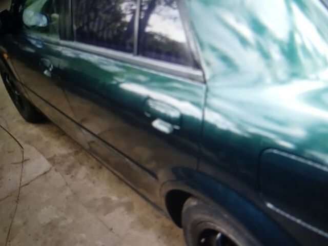 Зеленый Мазда 323, объемом двигателя 1.5 л и пробегом 180 тыс. км за 1800 $, фото 7 на Automoto.ua