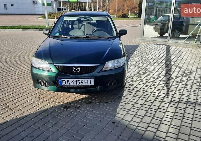 Зелений Мазда 323, об'ємом двигуна 1.3 л та пробігом 167 тис. км за 3473 $, фото 1 на Automoto.ua