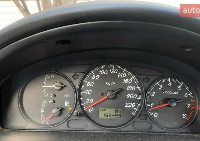 Зелений Мазда 323, об'ємом двигуна 1.3 л та пробігом 167 тис. км за 3473 $, фото 5 на Automoto.ua