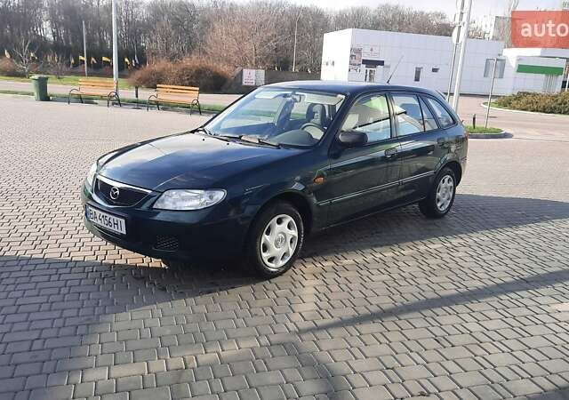 Зелений Мазда 323, об'ємом двигуна 1.3 л та пробігом 167 тис. км за 3473 $, фото 8 на Automoto.ua