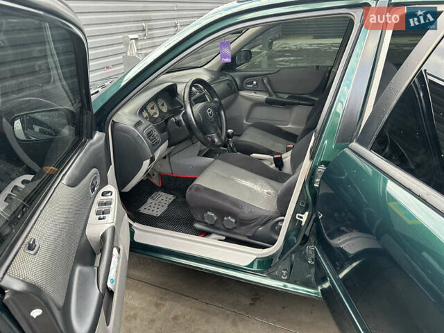 Зеленый Мазда 323, объемом двигателя 1.6 л и пробегом 230 тыс. км за 3000 $, фото 11 на Automoto.ua