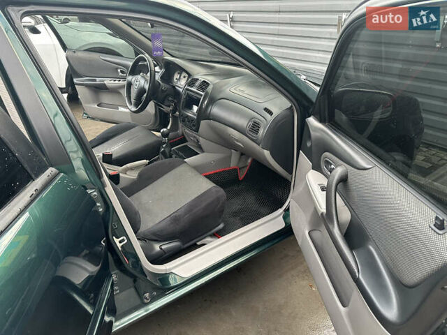 Зеленый Мазда 323, объемом двигателя 1.6 л и пробегом 230 тыс. км за 3000 $, фото 8 на Automoto.ua