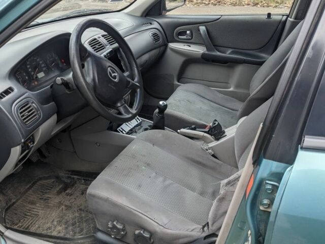 Зеленый Мазда 323, объемом двигателя 1.6 л и пробегом 289 тыс. км за 1999 $, фото 6 на Automoto.ua