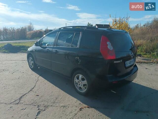 Черный Мазда 5, объемом двигателя 2 л и пробегом 218 тыс. км за 5200 $, фото 1 на Automoto.ua