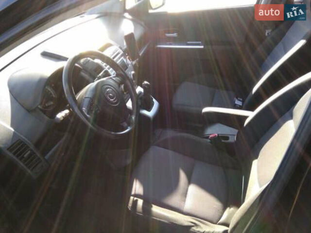 Черный Мазда 5, объемом двигателя 2 л и пробегом 318 тыс. км за 6300 $, фото 4 на Automoto.ua