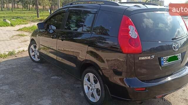 Черный Мазда 5, объемом двигателя 2 л и пробегом 298 тыс. км за 7000 $, фото 1 на Automoto.ua