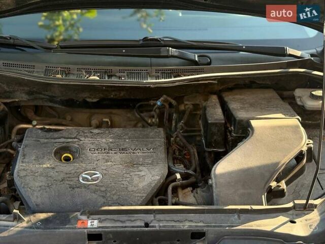 Черный Мазда 5, объемом двигателя 2 л и пробегом 141 тыс. км за 7000 $, фото 7 на Automoto.ua