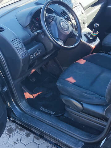 Черный Мазда 5, объемом двигателя 2 л и пробегом 325 тыс. км за 6200 $, фото 5 на Automoto.ua