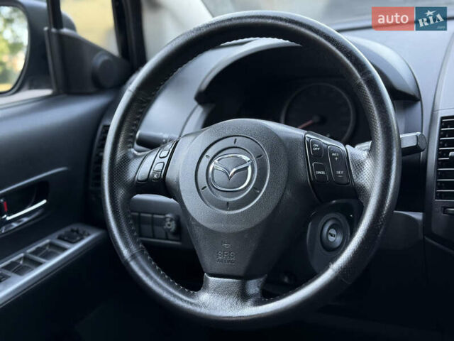 Черный Мазда 5, объемом двигателя 2 л и пробегом 231 тыс. км за 5999 $, фото 7 на Automoto.ua