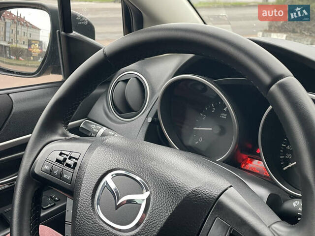 Черный Мазда 5, объемом двигателя 2 л и пробегом 210 тыс. км за 8100 $, фото 77 на Automoto.ua