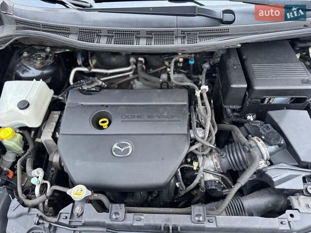 Черный Мазда 5, объемом двигателя 1.8 л и пробегом 171 тыс. км за 11000 $, фото 45 на Automoto.ua
