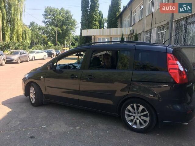 Серый Мазда 5, объемом двигателя 2 л и пробегом 235 тыс. км за 5100 $, фото 1 на Automoto.ua