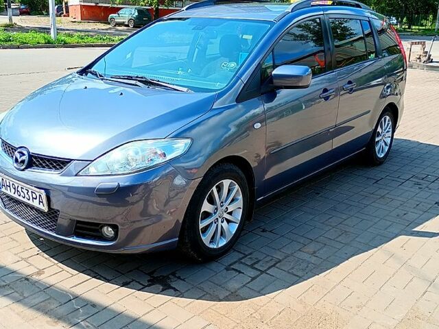 Серый Мазда 5, объемом двигателя 2 л и пробегом 330 тыс. км за 6000 $, фото 1 на Automoto.ua