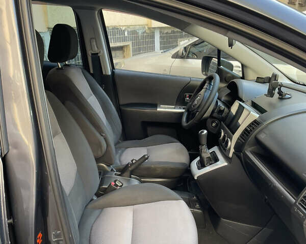 Серый Мазда 5, объемом двигателя 2 л и пробегом 246 тыс. км за 5400 $, фото 5 на Automoto.ua