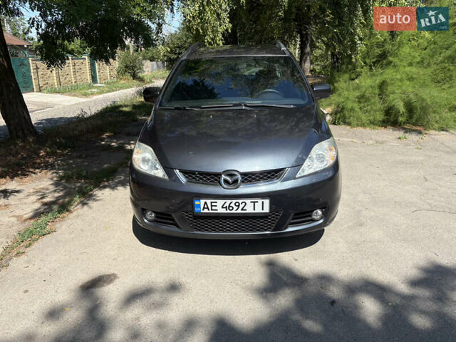 Серый Мазда 5, объемом двигателя 2 л и пробегом 255 тыс. км за 5800 $, фото 1 на Automoto.ua