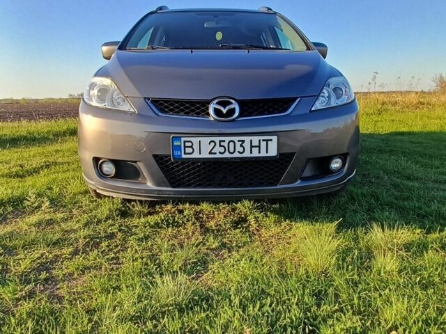Серый Мазда 5, объемом двигателя 2 л и пробегом 195 тыс. км за 5000 $, фото 1 на Automoto.ua