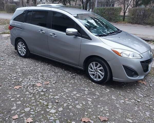 Серый Мазда 5, объемом двигателя 2.49 л и пробегом 145 тыс. км за 9000 $, фото 1 на Automoto.ua