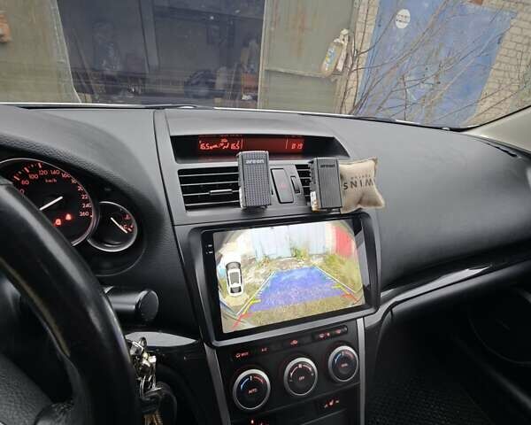 Белый Мазда 6, объемом двигателя 2 л и пробегом 195 тыс. км за 7600 $, фото 30 на Automoto.ua