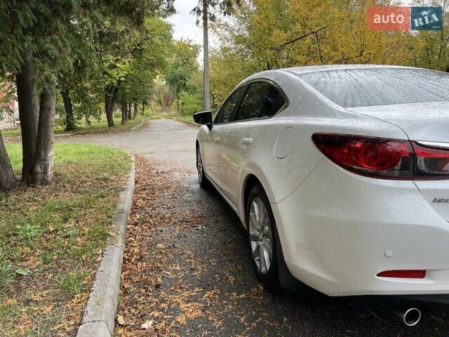 Білий Мазда 6, об'ємом двигуна 2 л та пробігом 171 тис. км за 11000 $, фото 16 на Automoto.ua