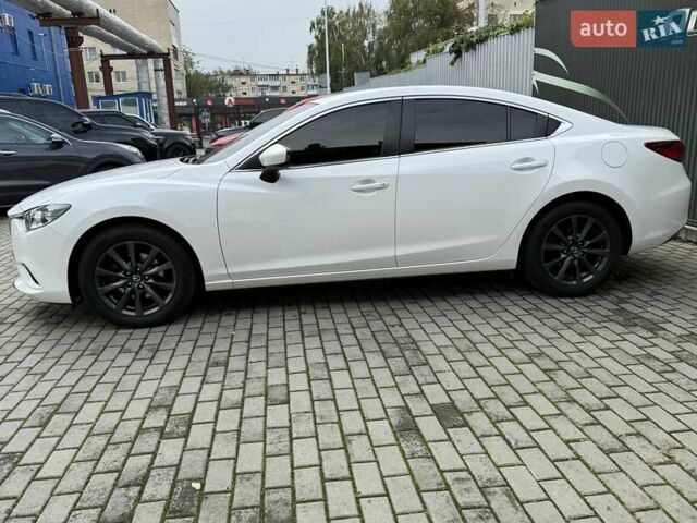 Білий Мазда 6, об'ємом двигуна 2 л та пробігом 145 тис. км за 12900 $, фото 20 на Automoto.ua