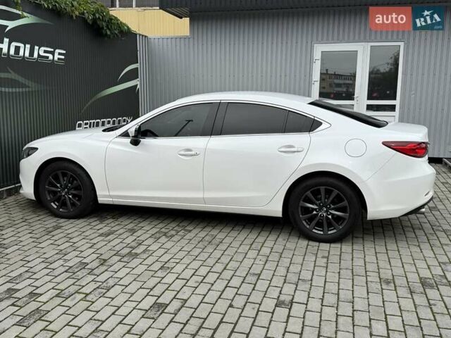 Білий Мазда 6, об'ємом двигуна 2 л та пробігом 145 тис. км за 12900 $, фото 31 на Automoto.ua
