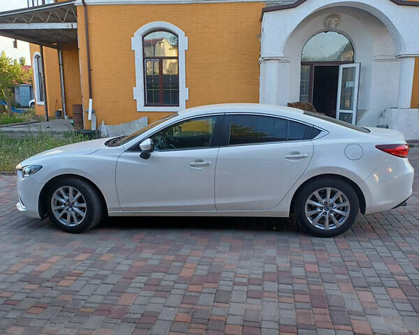 Белый Мазда 6, объемом двигателя 2 л и пробегом 67 тыс. км за 16000 $, фото 1 на Automoto.ua
