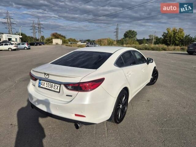 Білий Мазда 6, об'ємом двигуна 2 л та пробігом 105 тис. км за 16300 $, фото 18 на Automoto.ua