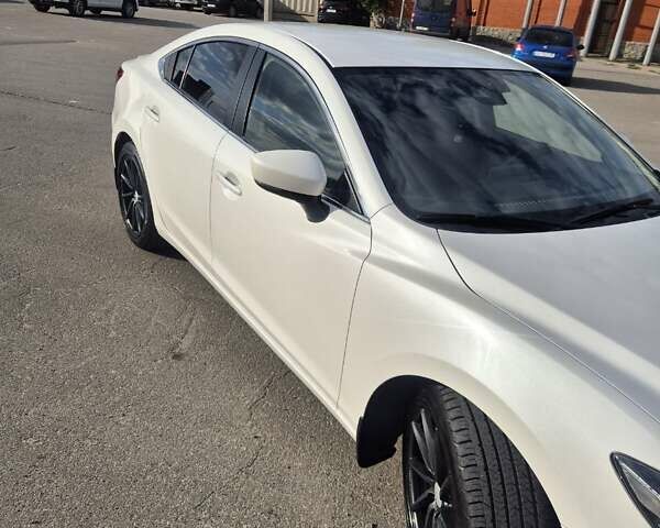 Білий Мазда 6, об'ємом двигуна 2 л та пробігом 105 тис. км за 16300 $, фото 16 на Automoto.ua