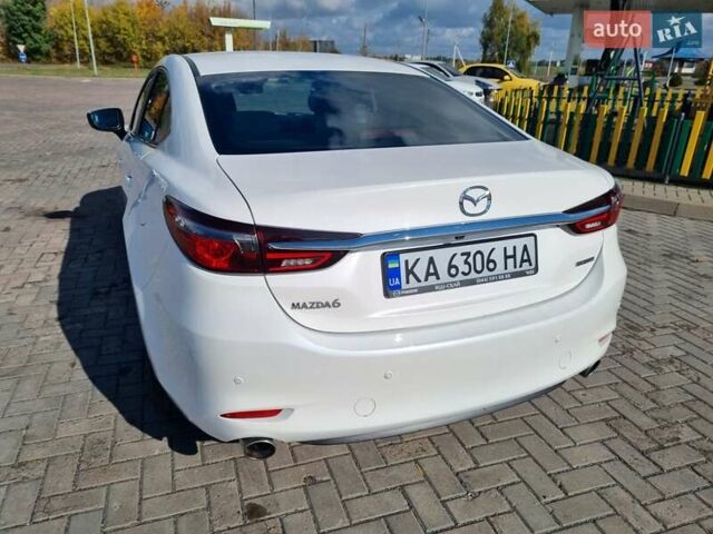 Білий Мазда 6, об'ємом двигуна 2 л та пробігом 51 тис. км за 25500 $, фото 14 на Automoto.ua