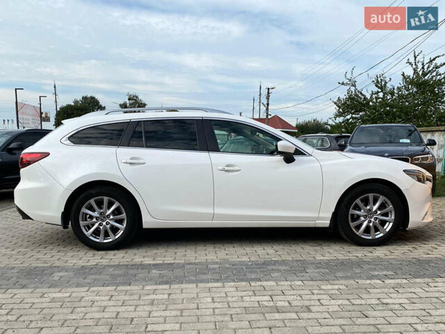 Білий Мазда 6, об'ємом двигуна 2 л та пробігом 130 тис. км за 16700 $, фото 7 на Automoto.ua