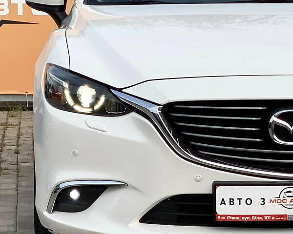 Білий Мазда 6, об'ємом двигуна 2 л та пробігом 130 тис. км за 16700 $, фото 9 на Automoto.ua