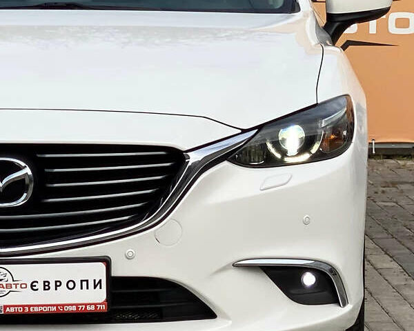 Білий Мазда 6, об'ємом двигуна 2 л та пробігом 130 тис. км за 16700 $, фото 8 на Automoto.ua