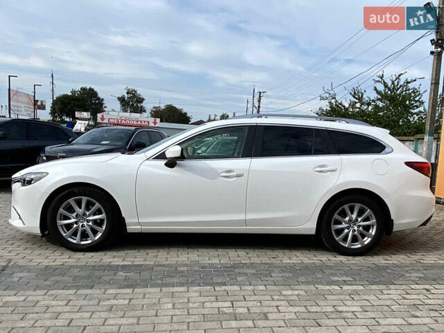 Білий Мазда 6, об'ємом двигуна 2 л та пробігом 130 тис. км за 16700 $, фото 6 на Automoto.ua
