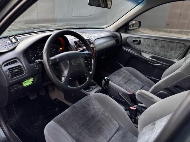 Черный Мазда 6, объемом двигателя 2 л и пробегом 300 тыс. км за 1800 $, фото 8 на Automoto.ua